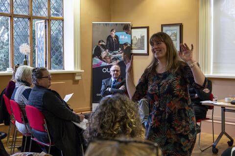 A group of people listening to talk