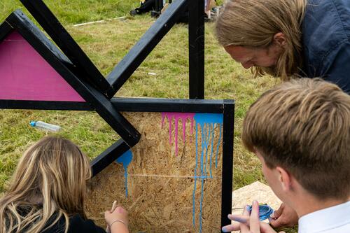 Colourful frames in the landscape with two young people and artist Daniel Pryde Jarman at National Trust The Weir Garden